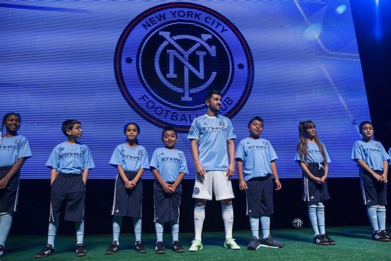 © Reuters. New York City FC player David Villa speaks during the unveiling of the club's new home jersey, in New York