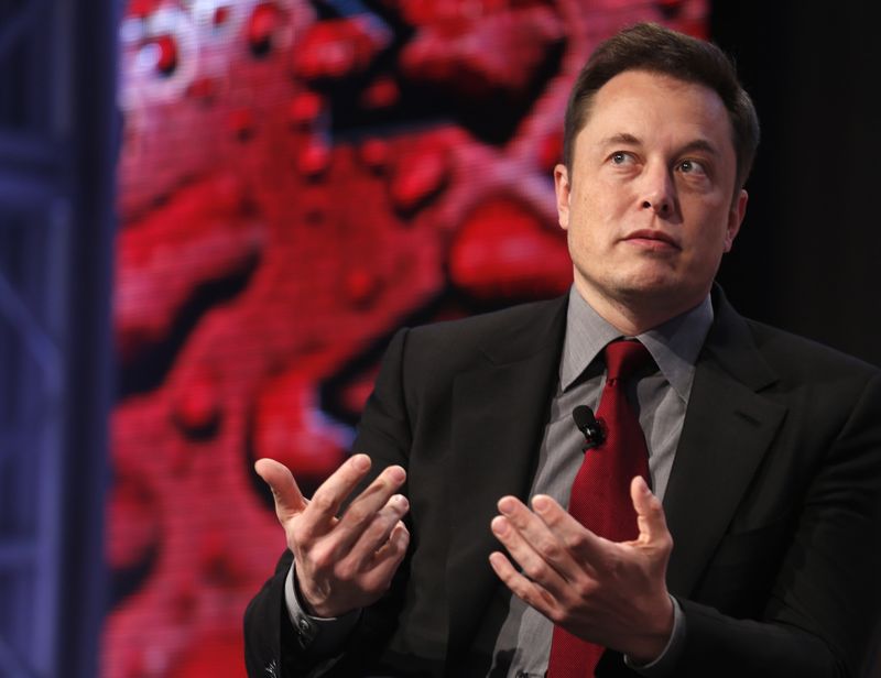 © Reuters. Tesla Motors CEO Elon Musk talks at the Automotive World News Congress at the Renaissance Center in Detroit