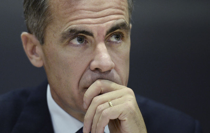 © Reuters. The Governor of the Bank of England Mark Carney listens during a Bank of England Financial Stability Report news conference, at the Bank of England, in the City of London