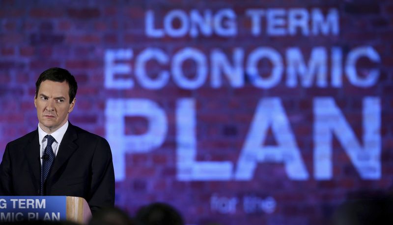 © Reuters. Britain's Chancellor of the Exchequer George Osborne watches as Prime Minister David Cameron talks to business leaders at a conference in the Old Granada TV Studios in Manchester