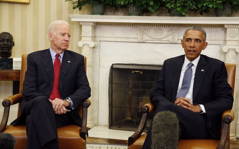 © Reuters. U.S. President Barack Obama is joined by Vice President Joseph Biden as he makes a statement about the mass shooting in Paris, while in the Oval Office at the White House in Washington