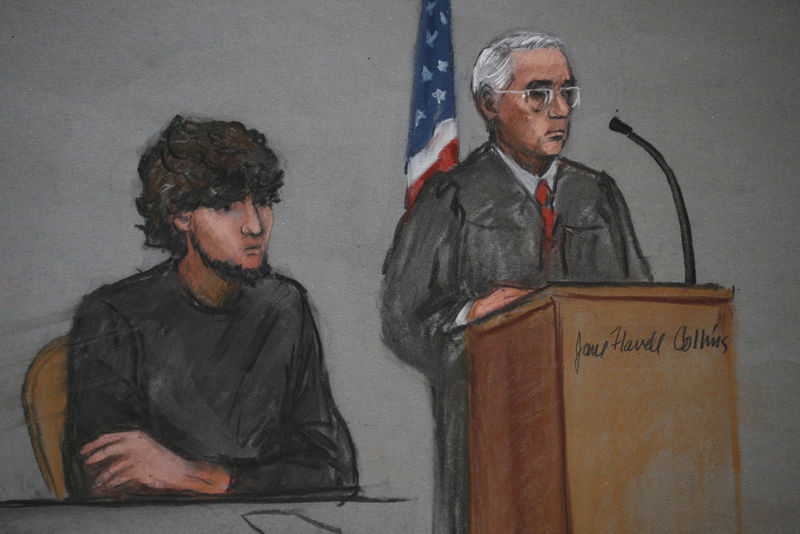 © Reuters. Accused Boston Marathon bomber Dzhokhar Tsarnaev is shown in a courtroom sketch next to Judge George O'Toole on the first day of jury selection at the federal courthouse in Boston