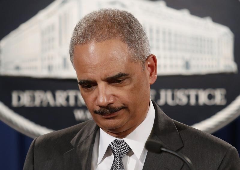 © Reuters. U.S. Attorney General Eric Holder leaves after making a statement about the grand jury decision not to seek an indictment in the Staten Island death of Eric Garner during an arrest in July, in Washington