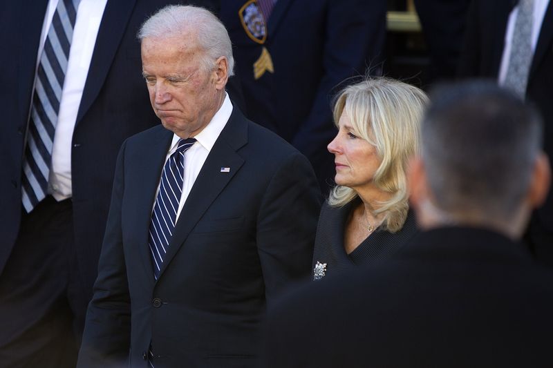 © Reuters. U.S. Vice President Joe Biden and wife Jill depart from the funeral service of slain NYPD officer Ramos at Christ Tabernacle Church in New York