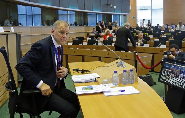 © Reuters. Health and Food Safety Commissioner-designate Andriukaitis of Lithuania gestures before his address to the European Parliament's Committees on Agriculture and Rural Development and Environment Public Health and Food Safety in Brussels