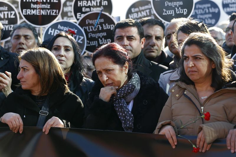 © Reuters. Widow of slain Turkish-Armenian editor Hrant Dink walks toward the Agos newspaper office during a demonstration to mark the eighth anniversary of his death, in Istanbul