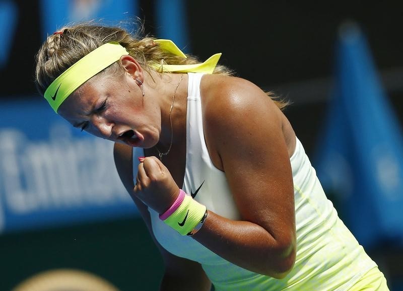 © Reuters. Azarenka of Belarus celebrates a point over Stephens of the U.S. during their women's singles match at the Australian Open 2015 tennis tournament in Melbourne