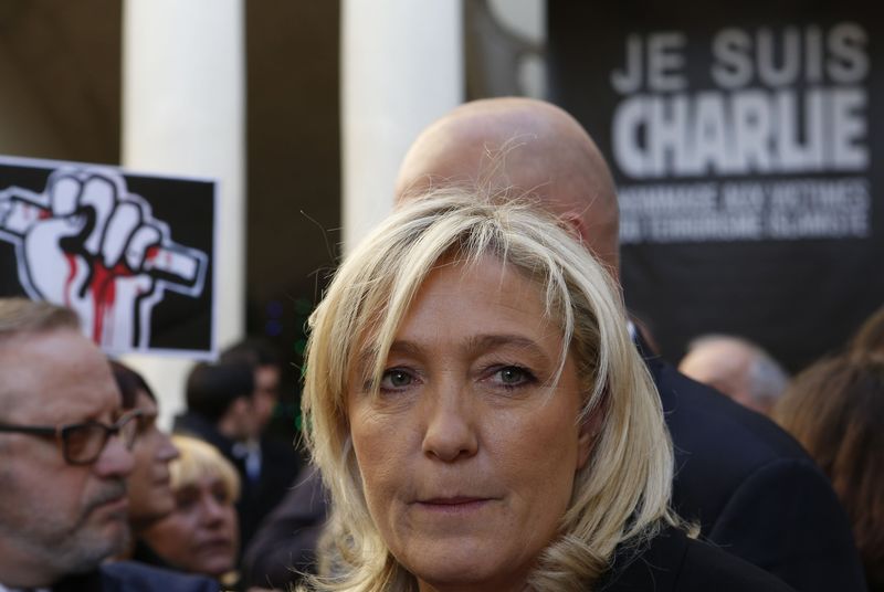 © Reuters. National Front leader Le Pen attends a gathering in front of the town hall in Beaucaire, paying tribute to the victims of the shooting by gunmen at the offices of Charlie Hebdo