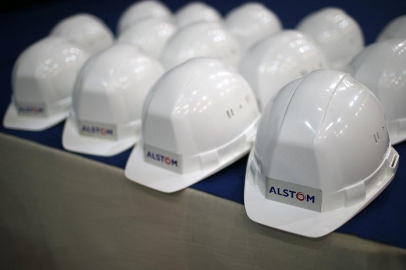 © Reuters. The Alstom logo is pictured on hard hats during an inaugural visit of their offshore wind turbine plants in Montoir-de-Bretagne