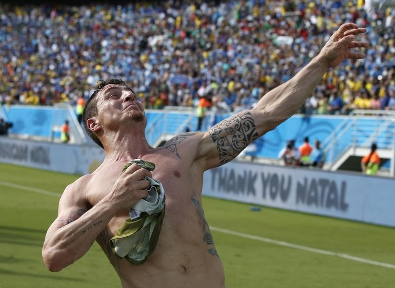 © Reuters. Uruguay's Rodriguez celebrates their win against Italy after their 2014 World Cup Group D soccer match at the Dunas arena in Natal 