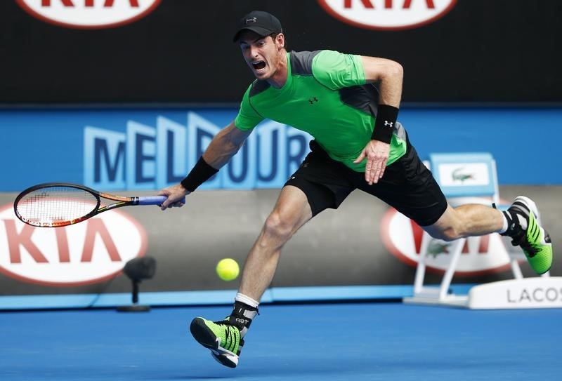 © Reuters. Murray of Britain hits a return to Matosevic of Australia during their men's singles match at the Australian Open 2015 tennis tournament in Melbourne