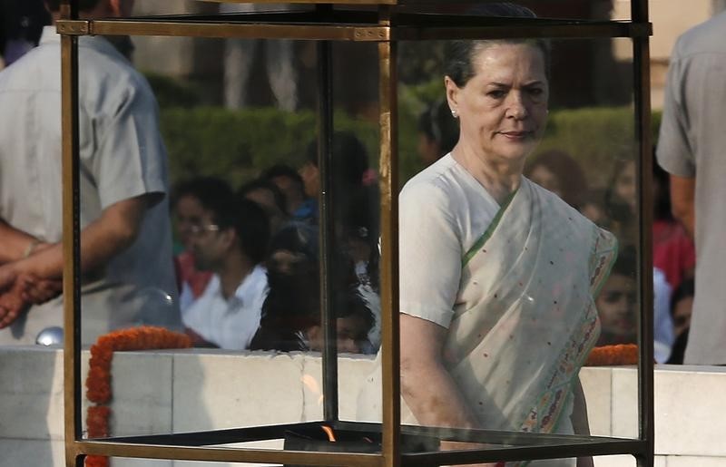 © Reuters. India's Congress Party chief Sonia Gandhi walks after paying homage at the Mahatma Gandhi memorial on the 145th birth anniversary of Mahatma Gandhi at Rajghat in New Delhi