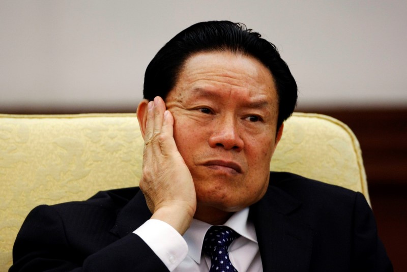 © Reuters. File photo of China's former Public Security Minister Zhou reacting as he attends the Hebei delegation discussion sessions at the 17th National Congress of the CPC in Beijing