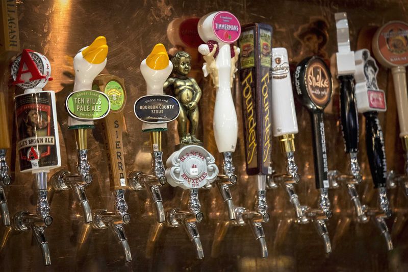 © Reuters. Goose Island beer taps are seen amongst other craft beers at a bar in New York