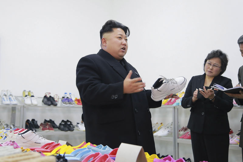 © Reuters. North Korean leader Kim provides field guidance to the Ryuwon Shoes Factory in this undated photo released by North Korea's KCNA in Pyongyang