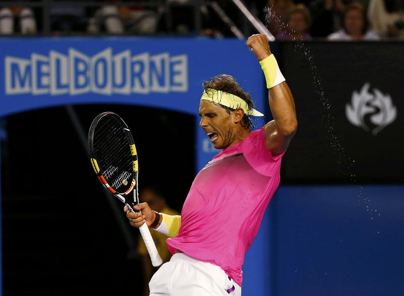© Reuters. Rafael Nadal of Spain celebrates after defeating Dudi Sela of Israel in their men's singles third round match at the Australian Open 2015 tennis tournament in Melbourne 