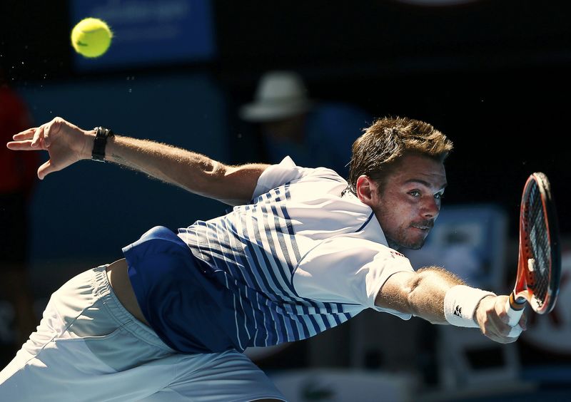 © Reuters. Wawrinka of Switzerland hits a return to Nieminen of Finland during their men's singles match at the Australian Open 2015 tennis tournament in Melbourne
