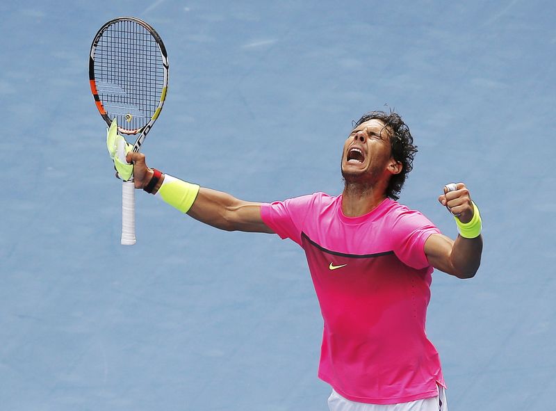 © Reuters. Nadal of Spain celebrates defeating Anderson of South Africa in their men's singles match at the Australian Open 2015 tennis tournament in Melbourne 