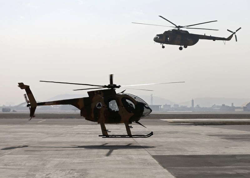 © Reuters. Afghan Air Force helicopters land at the military airport in Kabul