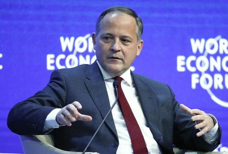 © Reuters. Coeure, member of the Executive Board of the European Central Bank (ECB), gestures during the session 'The Global Economic Outlook' in the Swiss mountain resort of Davos