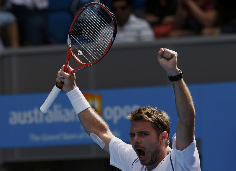 © Reuters. Wawrinka of Switzerland celebrates after defeating Garcia-Lopez of Spain during their men's singles fourth round match at the Australian Open 2015 tennis tournament in Melbourne