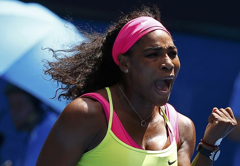 © Reuters. Serena of the U.S. celebrates a point over Cibulkova of Slovakia during their women's singles quarter-final match at the Australian Open 2015 tennis tournament in Melbourne