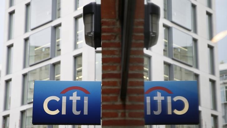 © Reuters. A Citibank sign is reflected in a window in the City of London