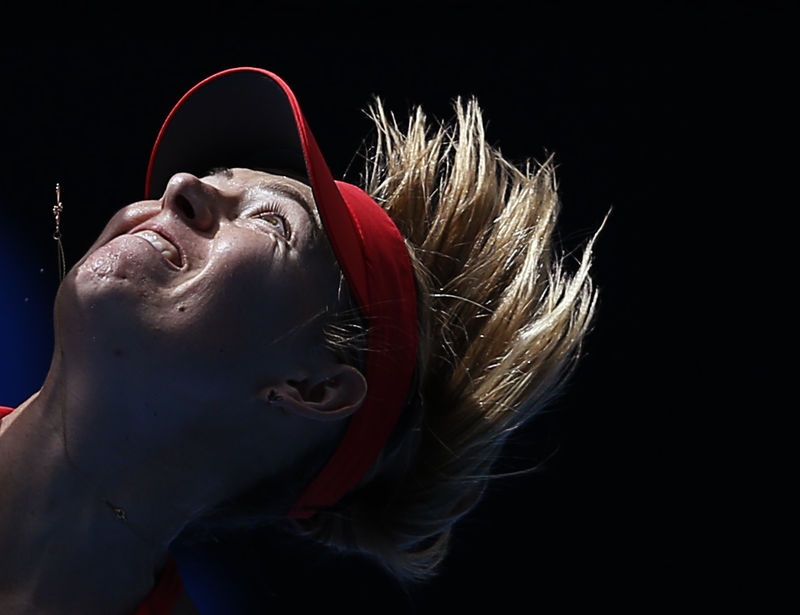 © Reuters. Sharapova of Russia serves to compatriot Makarova during their women's singles semi-final match at the Australian Open 2015 tennis tournament in Melbourne 