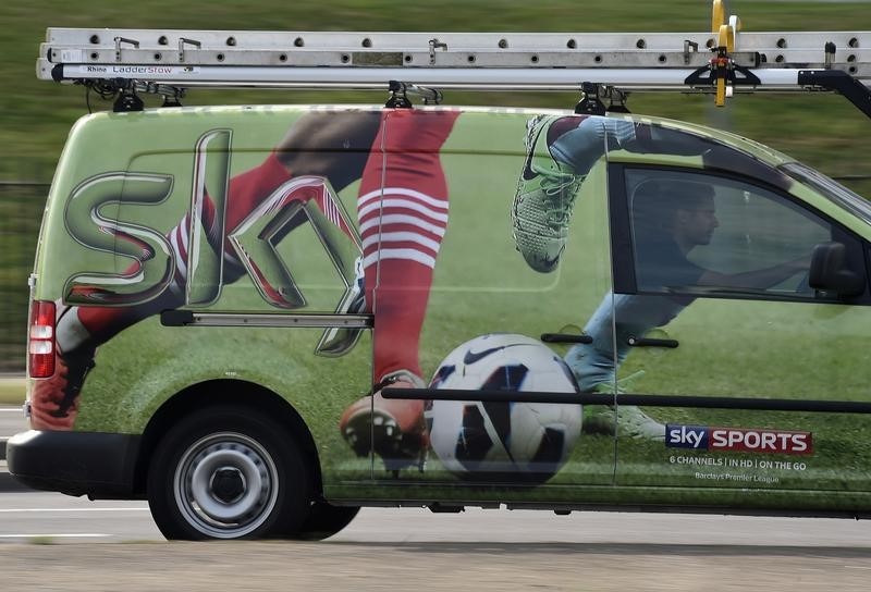 © Reuters. A British Sky Broadcasting Group (BSkyB) work van is driven in west London
