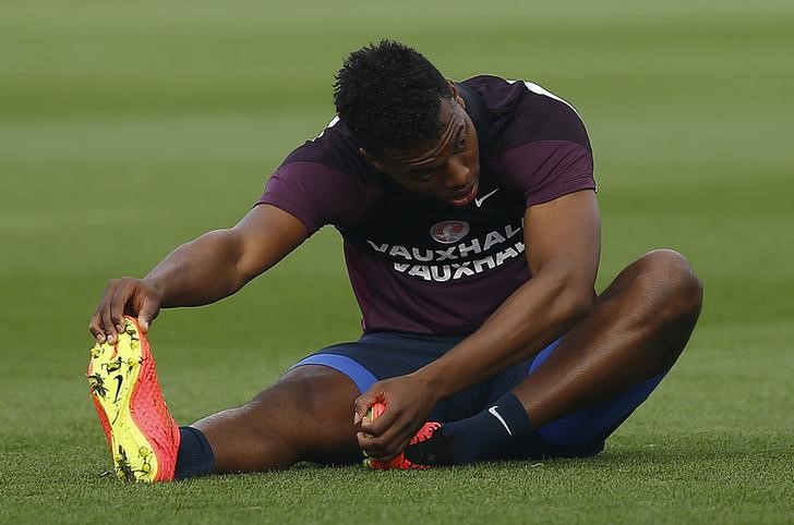 © Reuters. England's Sturridge stretches during a training session at the St George's Park training complex