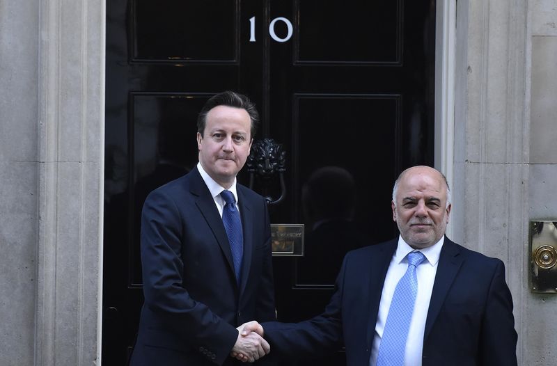 © Reuters. Britain's Prime Minister Cameron shakes hands with Iraq's Prime Minister al-Abadi outside of number 10 Downing Street in London