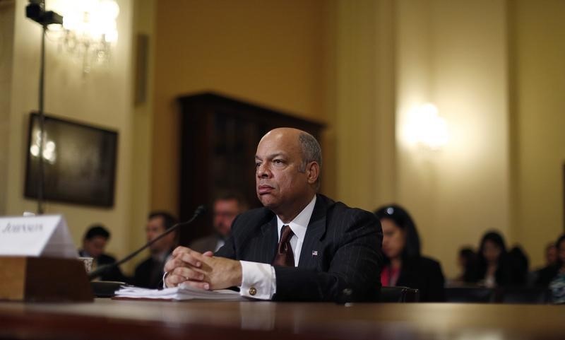 © Reuters. U.S. Department of Homeland Security Secretary Johnson listens to a question from a Republican member of Congress as he defends Obama's executive action on immigration at Capitol Hill in Washington