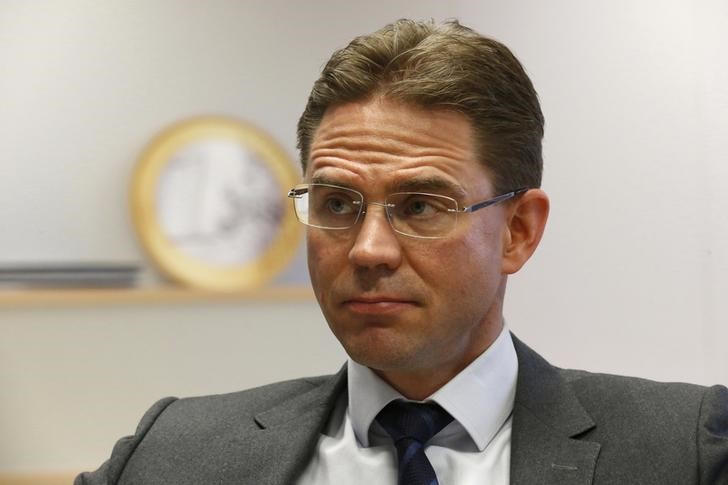 © Reuters. Katainen reacts during a Reuters interview in Brussels