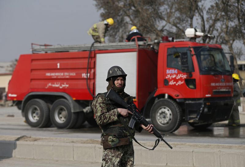 © Reuters. An Afghan National Army soldier keeps watch after clashes with protesters in Kabul