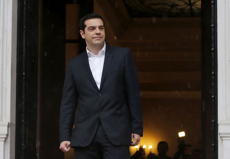 © Reuters. Greek Prime Minister Tsipras waits for European Parliament President Martin Schulz outside the Greek Premier's office in Athens