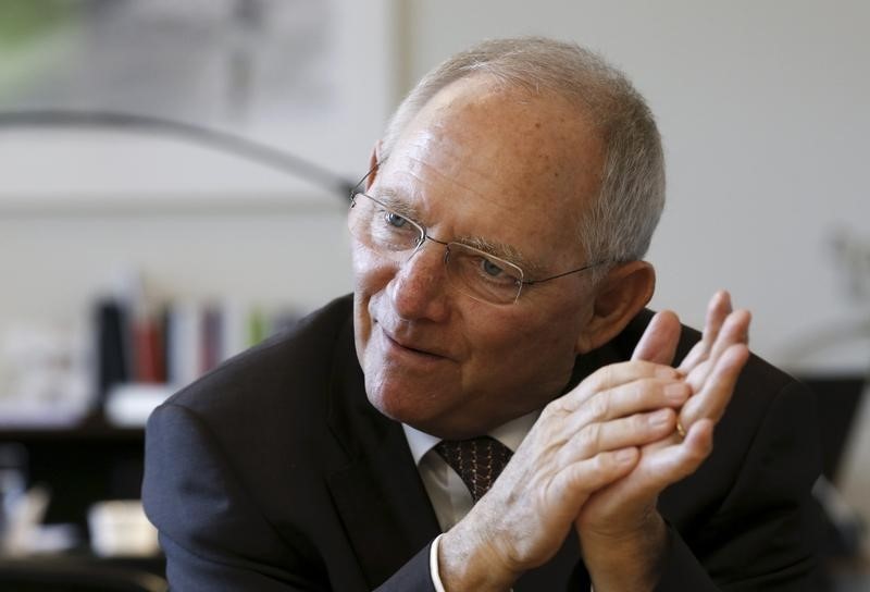 © Reuters. German Finance Minister Schaeuble leaves his office after taking part in Reuters Euro Zone Summit in Berlin