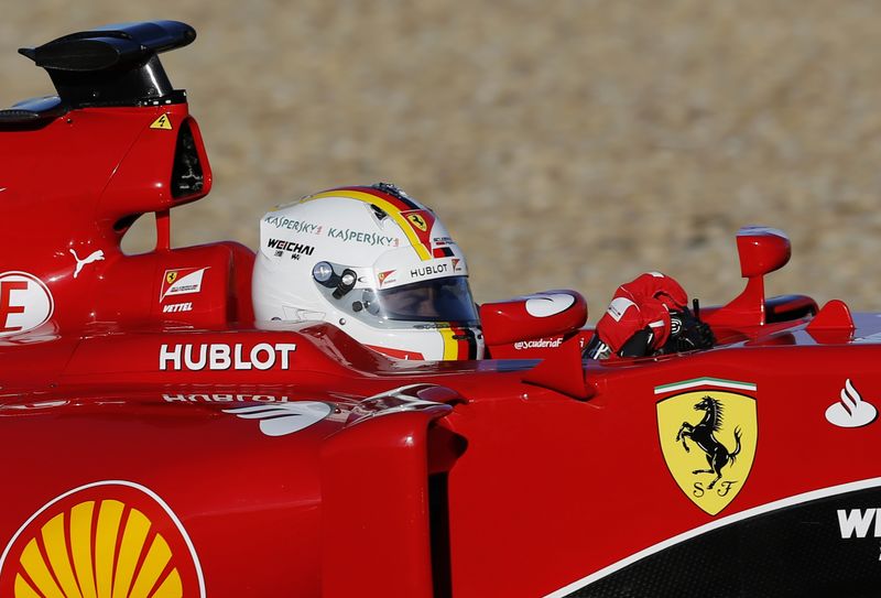 © Reuters. Ferrari Formula One racing driver Sebastian Vettel of Germany drives the new Ferrari SF15T car during pre-season testing at the Jerez racetrack in southern Spain