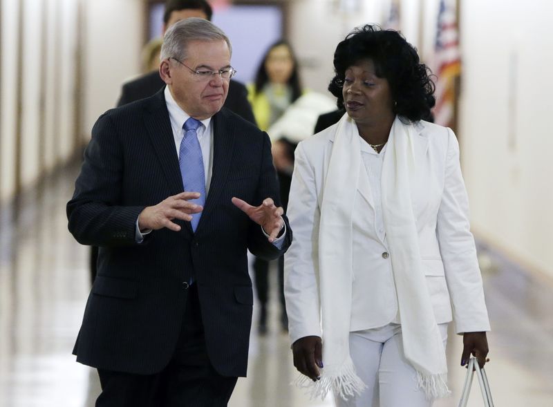 © Reuters. Senator Menendez escorts Cuba's Ladies in White leader Solar to Senate Foreign Relations' Western Hemisphere Subcommittee hearing in Washington