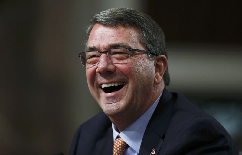 © Reuters. U.S. defense secretary-nominee Carter laughs while testifying at Senate Armed Services Committee confirmation hearing on Capitol Hill in Washington