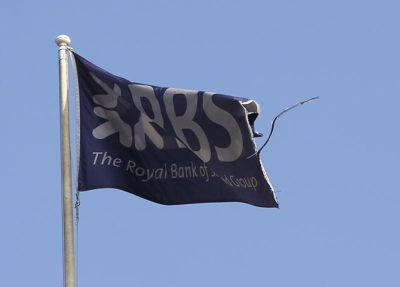 © Reuters. A flag flies above the head office of RBS in St Andrew Square in Edinburgh