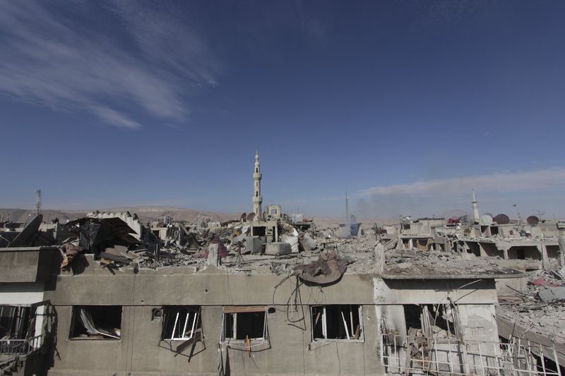 © Reuters. A general view of the destruction after what activists said were at least 20 air strikes by forces loyal to Syria's President Bashar al-Assad in the Douma neighbourhood of Damascus