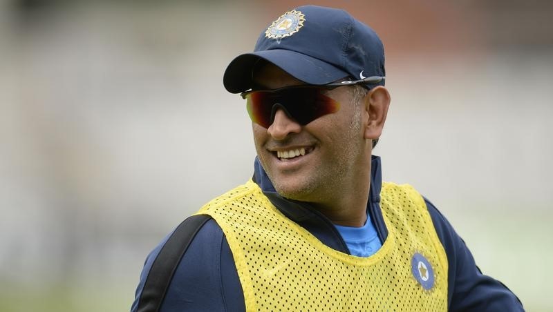 © Reuters. India's captain Mahendra Singh Dhoni looks on during a training session before the fourth cricket test match against England at the Old Trafford cricket ground in Manchester