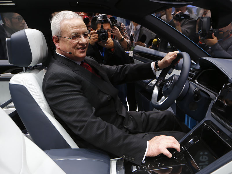 © Reuters. Volkswagen's Winterkown sits in a Volkswagen Cross Coupe GTE concept vehicle as it is displayed during the first press preview day of the North American International Auto Show in Detroit