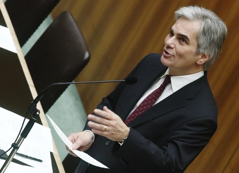 © Reuters. Austrian Chancellor Faymann delivers a speech during a session of the parliament in Vienna