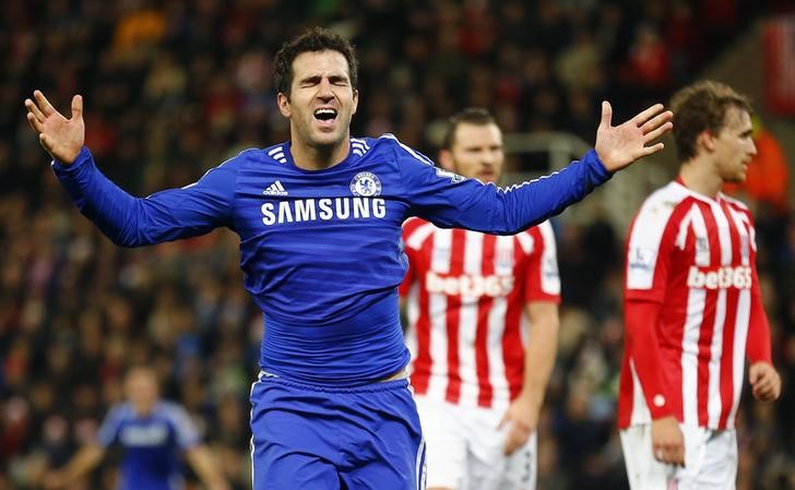 © Reuters. Chelsea's Fabregas celebrates after scoring the second goal during their English Premier League match against Stoke City in Stoke-on-Trent