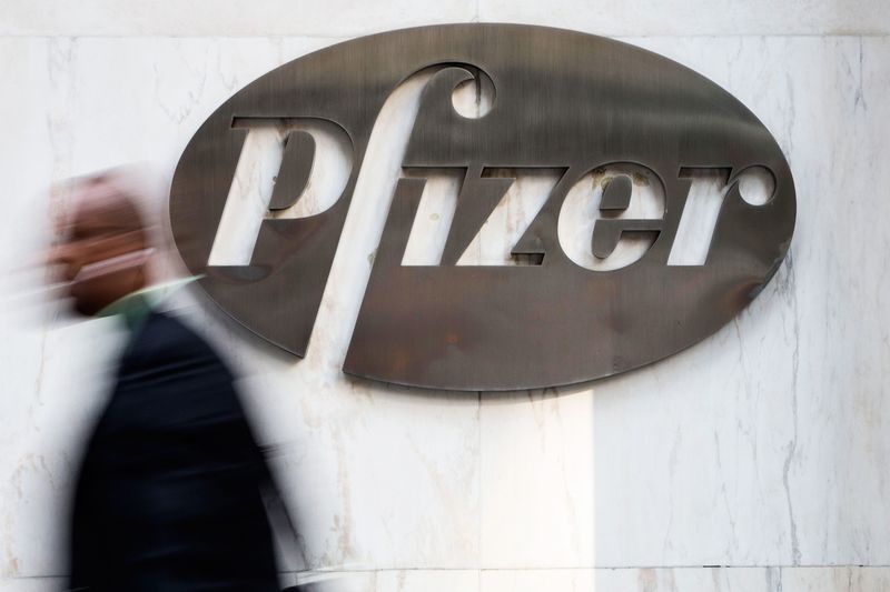 © Reuters. A man walks past Pfizer's world headquarters in New York in this file photo