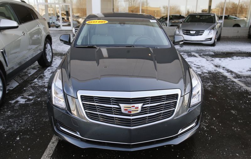 © Reuters. An unsold Cadillac ATS vehicle sits in the front lot of a Cadillac automobile dealership in Plymouth