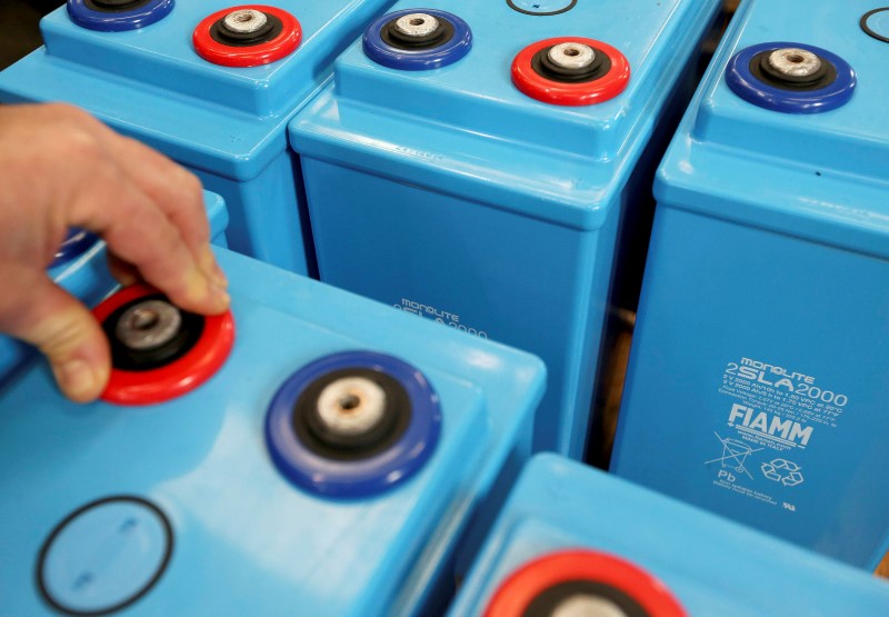 © Reuters. A worker prepares FIAMM batteries in this photo illustration taken at the battery maker's factory in Avezzano, near L'Aquila