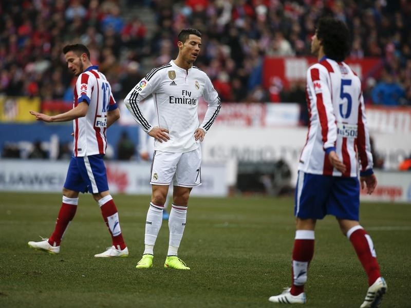 © Reuters. Real Madrid's Cristiano Ronaldo reacts during their Spanish first division soccer match against Atletico Madrid in Madrid