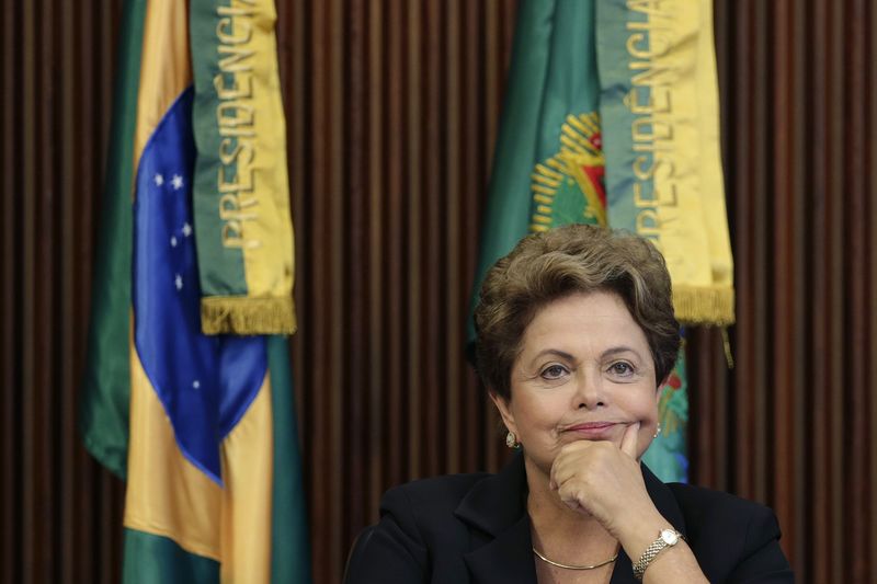 © Reuters. Brazil's President Rousseff reacts during a meeting of the CNDI at the Planalto Palace in Brasilia